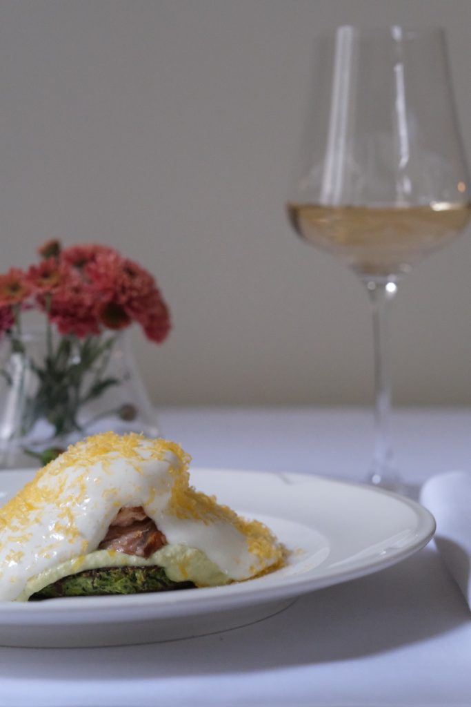 Zucchini pancakes with oven smoked salmon poached egg and parmesan foam1 e1763567559161